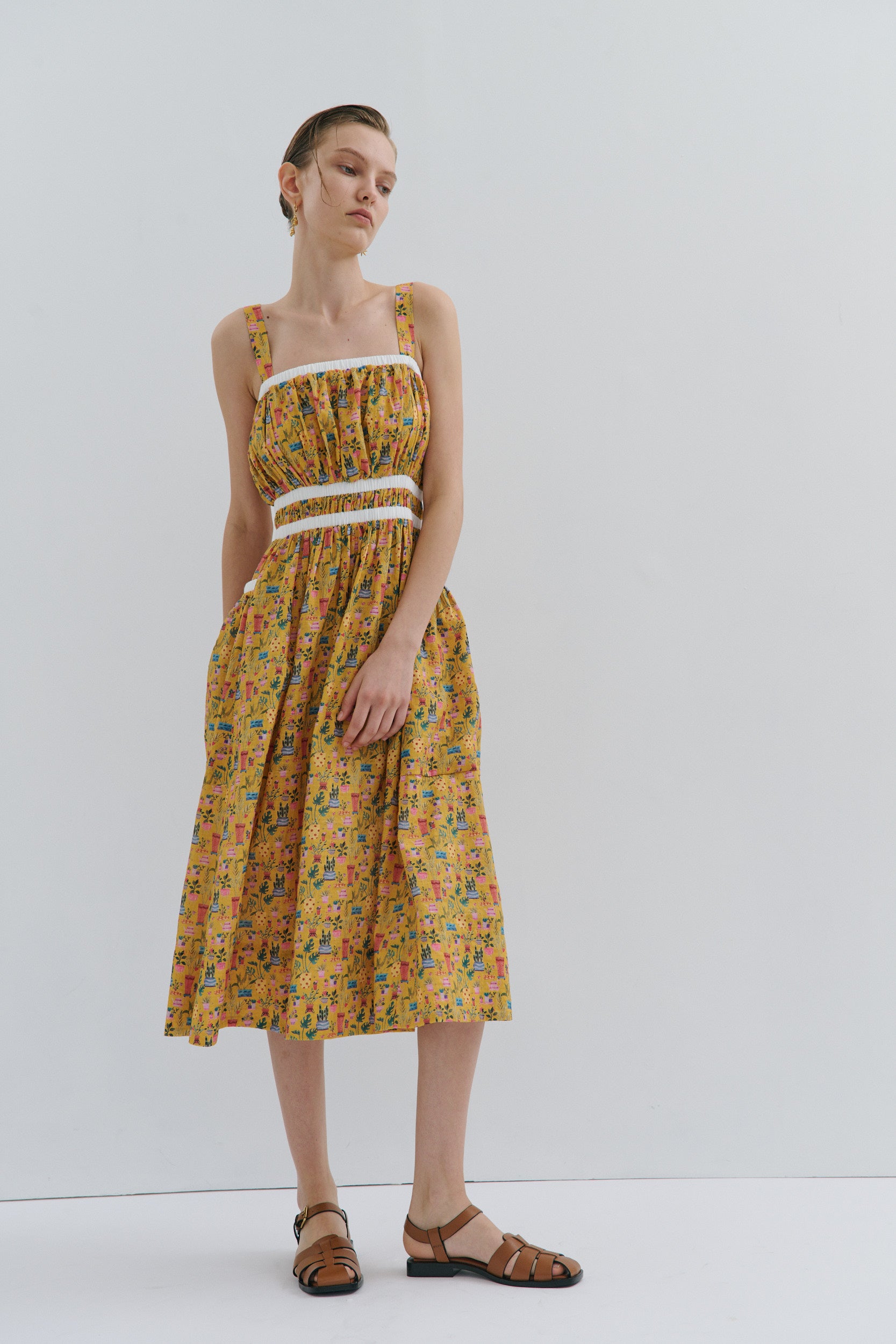 Woman wearing a floral dress on a white background