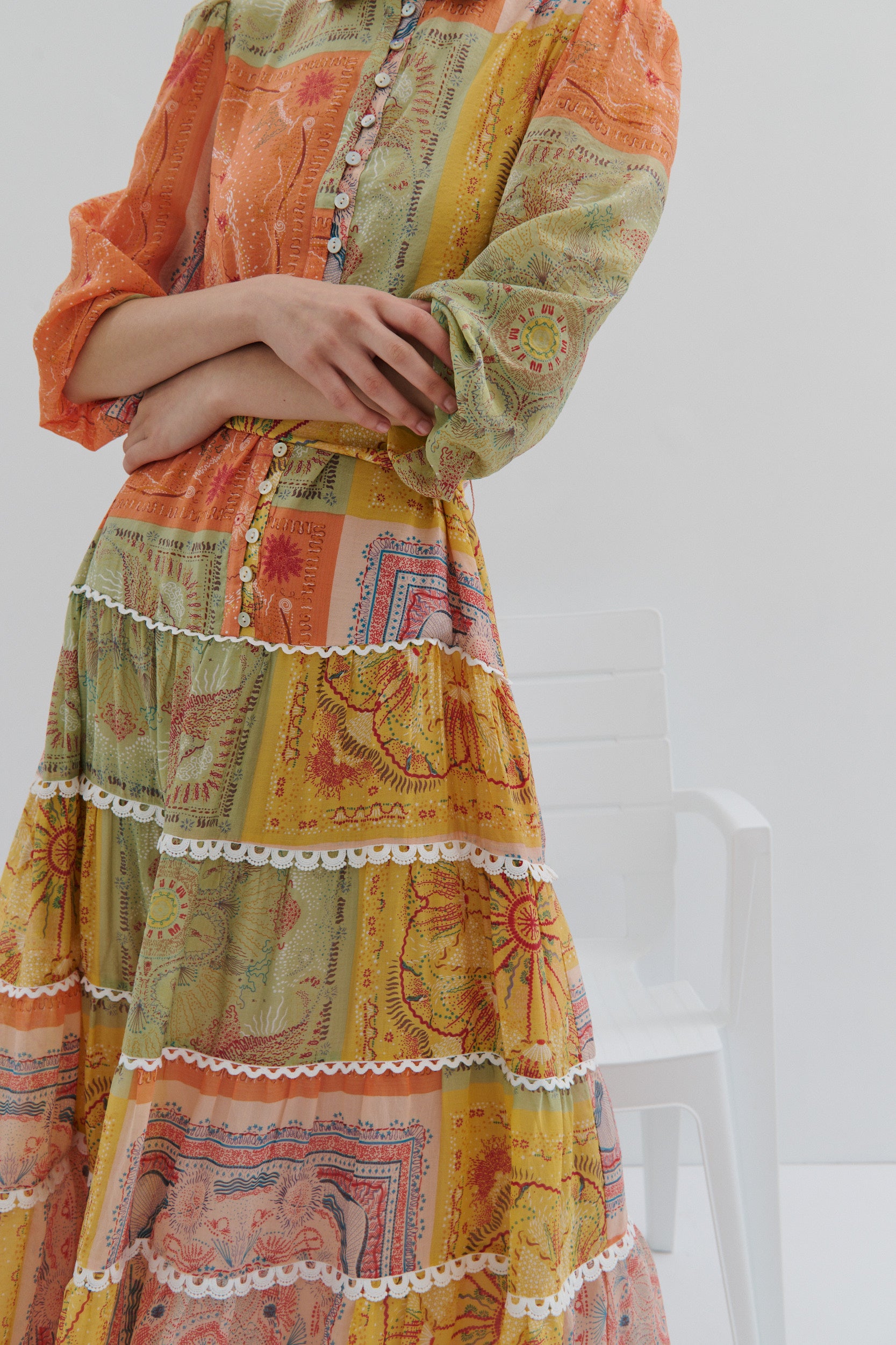 Colorful patterned dress with a white background