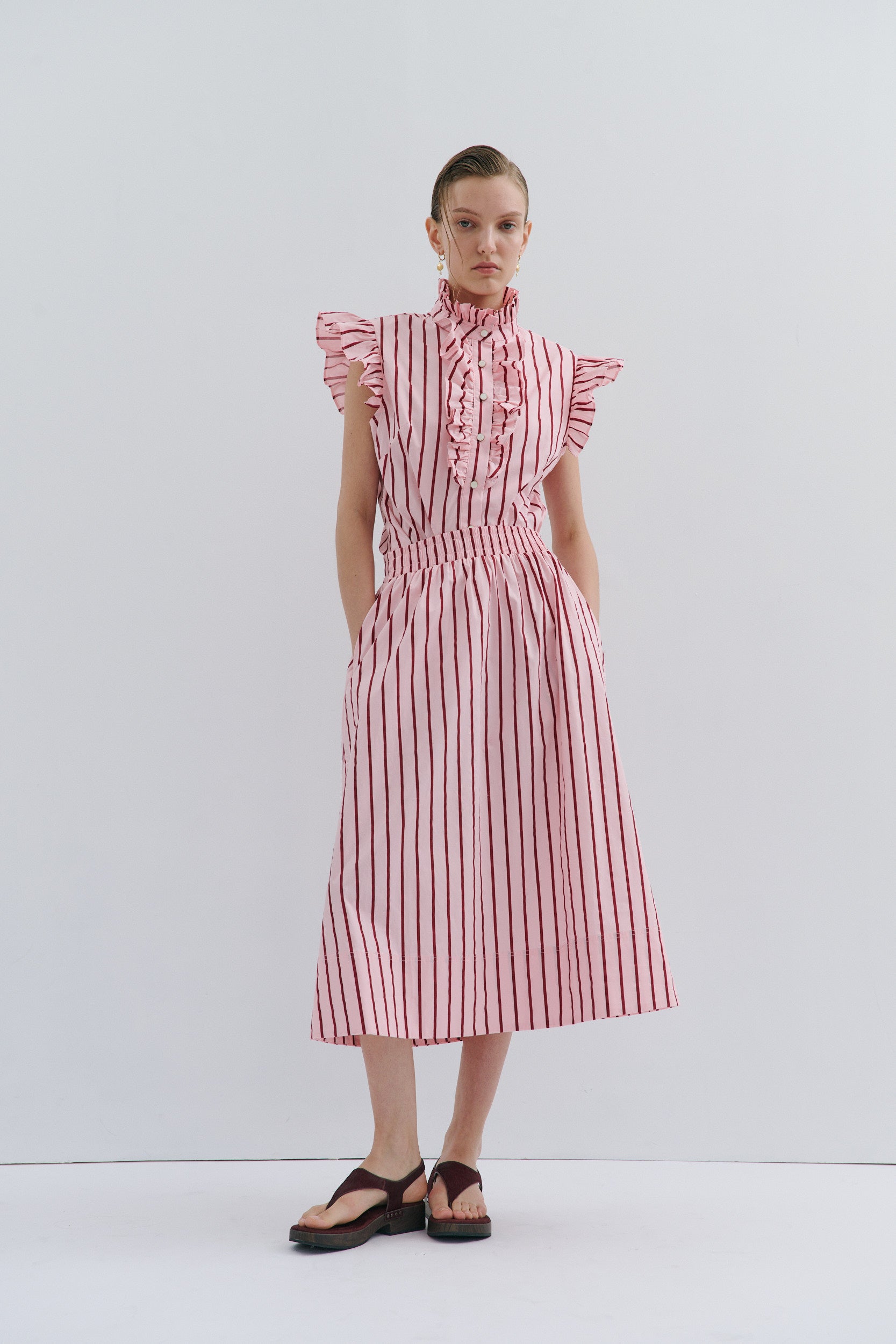 woman wearing pink and red stripe shirt and skirt by Australian fashion brand Maevarii