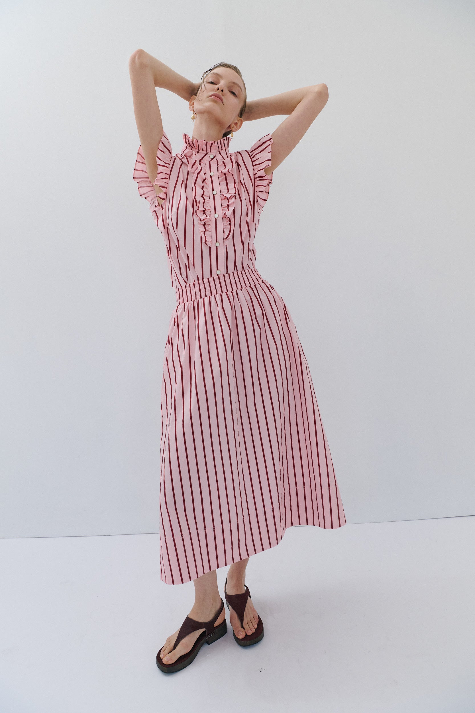 woman wearing a pink and red stripe outfit by women's clothing brand Maevarii