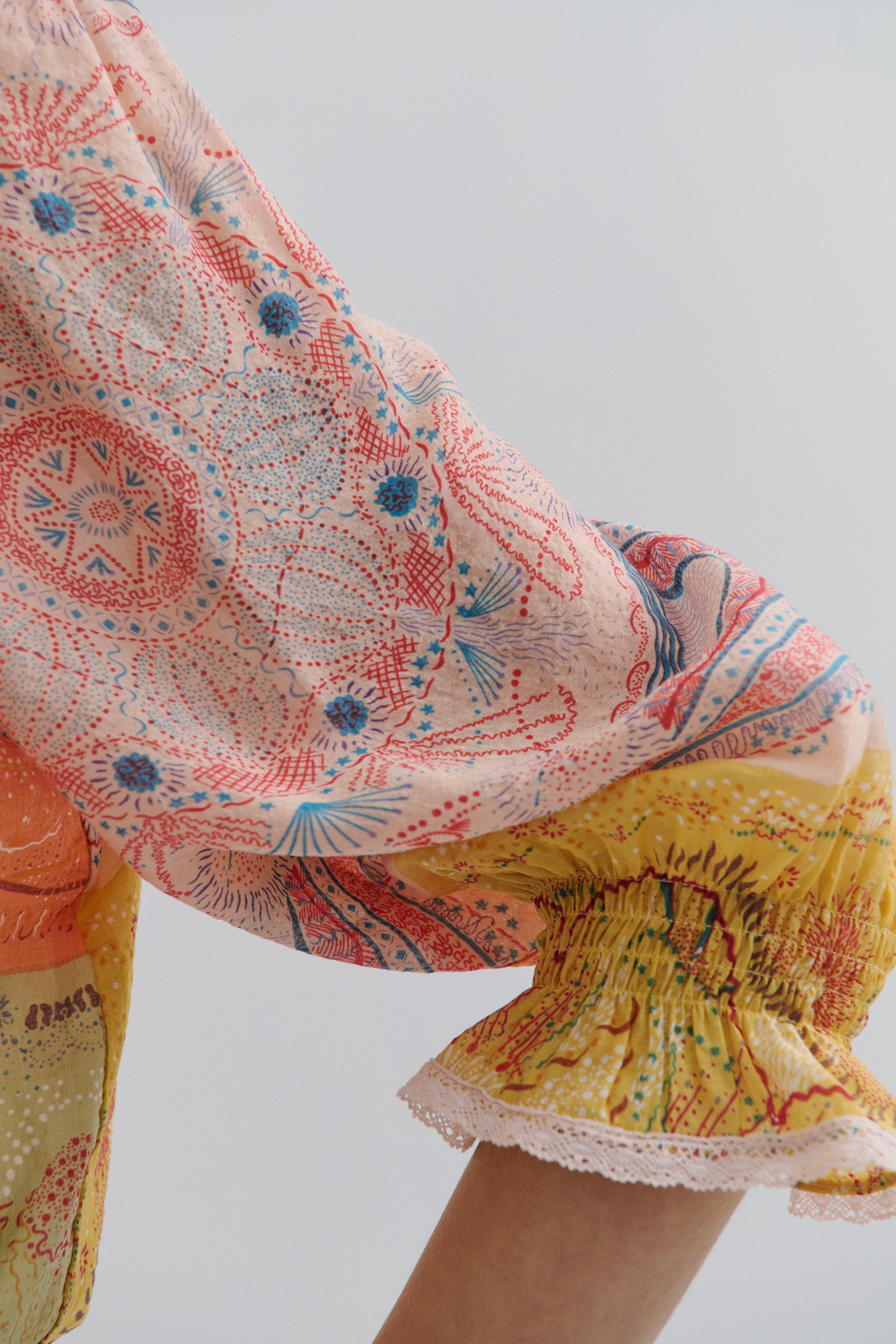 Colorful floral-patterned fabric with a plain background